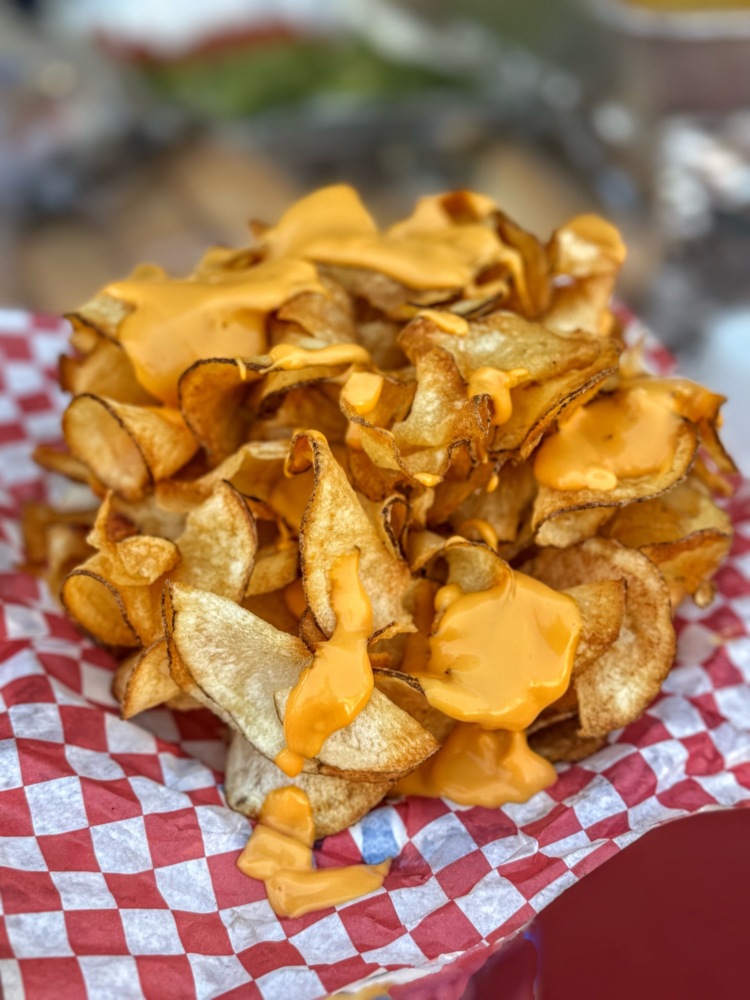 Butterfly chips drizzled with cheese sauce