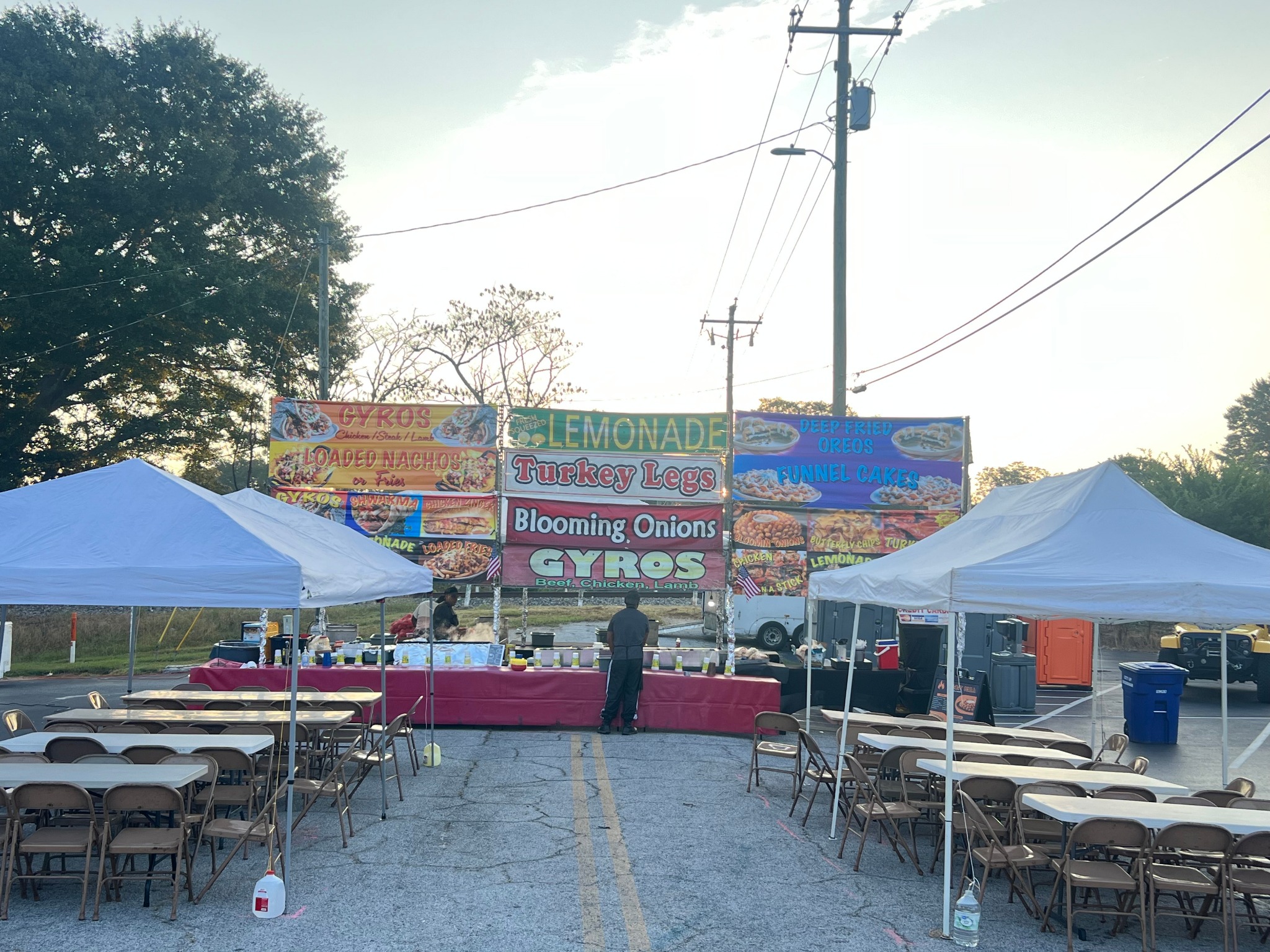Yummy Grill event setup with tents and seating