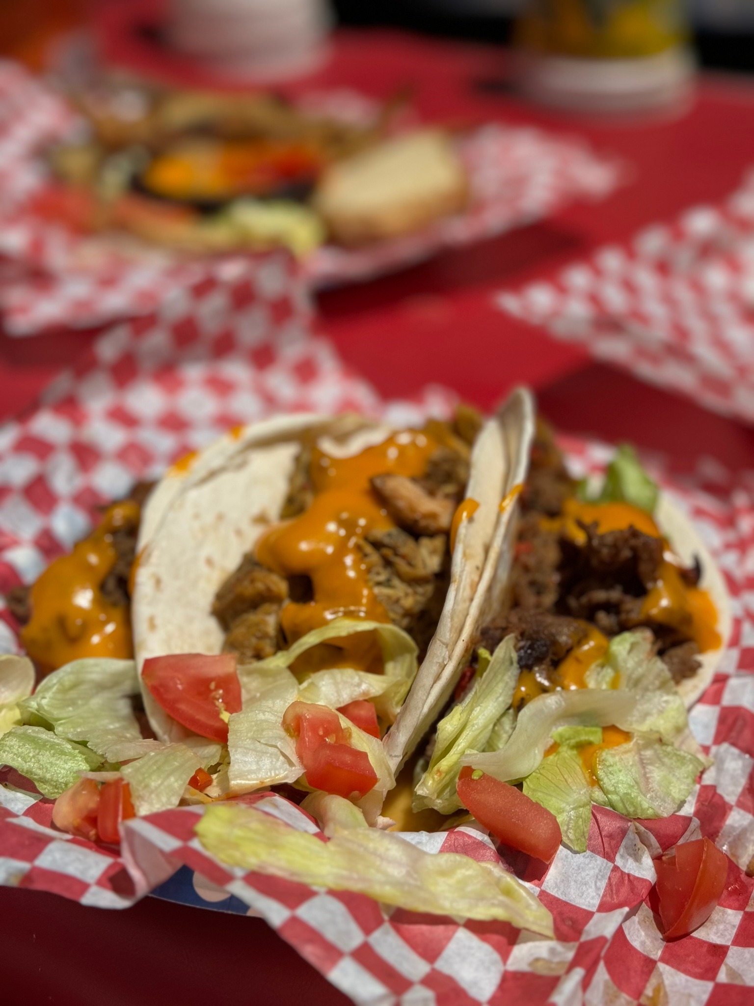 Tacos topped with orange sauce
